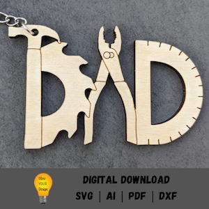 May include: Wooden cutout of the word "DAD" with tools incorporated into the letters. The "D" on the left has a saw blade and a hammer. The "A" has a pair of pliers. The "D" on the right has a protractor.