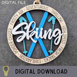 May include: A wooden round ornament with the word "Skiing" in white script and blue ski poles and skis. The ornament is surrounded by a circle of text that reads "Powder Chaser - Frosty Air - Adventurous - Thrilling - High Speed - Fresh Tracks - Exhilaration".