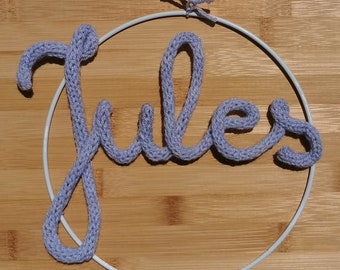 Word and First Name in Wool Knit in a White Circle for Decoration