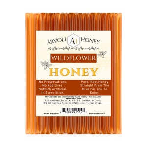 May include: A package of 275 grams of Arvoli Wildflower Honey. The label reads "Arvoli A Honey Wildflower Honey" and includes the text "No Preservatives. No Additives. Nothing Artificial. In Every Stick." and "Pure, Raw, Honey Straight From The Hive For You To Enjoy."