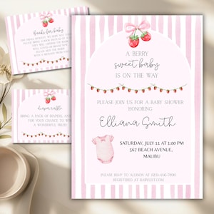 May include: Pink baby shower invitations with a strawberry theme. The main invitation reads "A Berry Sweet Baby is on the Way" and includes details for the event. Additional cards request books and a diaper raffle.