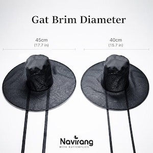 May include: Two black Gat hats with long ribbons, featuring a textured mesh crown and wide brim. The image displays two sizes: one with a 17.7 inch brim diameter and one with a 15.7 inch brim diameter. The text reads Gat Brim Diameter and Navirang.