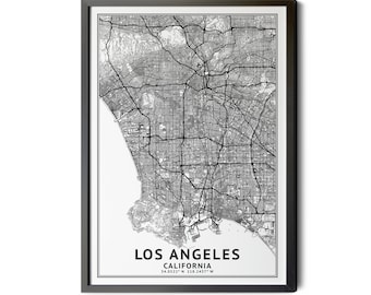 May include: Framed monochrome map print of Los Angeles, California. The detailed map shows the city's road network and terrain. The text "LOS ANGELES CALIFORNIA" is printed at the bottom, with the coordinates 34.0522° N 118.2437° W.
