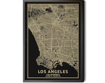 May include: A framed map of Los Angeles, California, in gold and black. The map shows the city's streets and landscape. The text "LOS ANGELES CALIFORNIA" and coordinates are at the bottom. The frame is black.