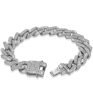 May include: A silver chain bracelet with a curb link design. The bracelet is fully encrusted with clear cubic zirconia stones.