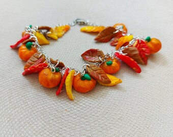 Pumpkin bracelet. Handmade autumn bracelet with pumpkins and leaves. Autumn jewelry made of polymer clay. orange bracelet