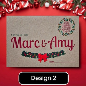 May include: A brown gift card with the text "A Special Gift For Marc & Amy" in red script. The card features a Christmas wreath design and the words "Merry Christmas and Happy New Year". A red bow and the words "From" are also visible.