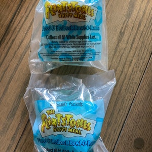 McDonalds Flintstone HappyMeal Toy , set of 2, unused.