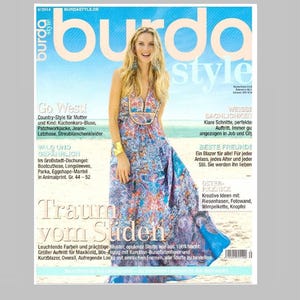 Puede incluir: Una portada de revista "burda style" con fecha de abril de 2014. Presenta a una mujer con un vestido largo estampado. El texto incluye "Go West!" y "Traum vom Süden".