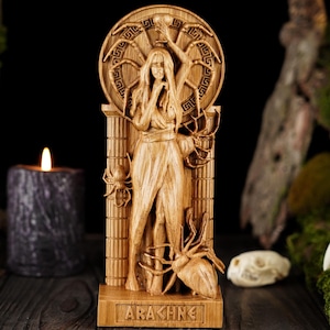 May include: A wooden sculpture of Arachne, the Greek mythological figure who challenged Athena to a weaving contest. The sculpture depicts Arachne as a woman with spider legs, standing in a doorway with a spider web behind her. The sculpture is carved with intricate details and is a beautiful example of craftsmanship.