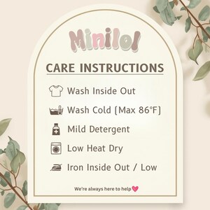 a care instructions sign with icons for washing different types of clothes, such as a t-shirt, cold, mild detergent, low heat dry, ironing, and ironing inside out. The sign provides guidance on how to properly care for the clothes, and it is accompanied by a heart symbol at the bottom, indicating that the image is a helpful resource for users.