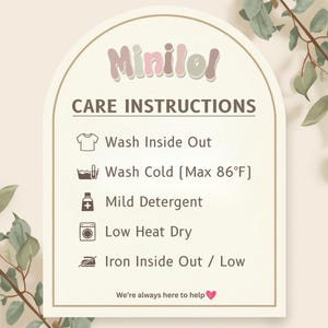 a care instructions sign with icons for washing different types of clothes, such as a t-shirt, cold, mild detergent, low heat dry, ironing, and ironing inside out. The sign provides guidance on how to properly care for the clothes, and it is accompanied by a heart symbol at the bottom, indicating that the image is a helpful resource for users.