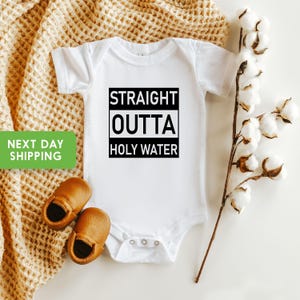 Straight Outta Holy Water Onesie® with funny baptism baby bodysuit design