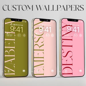 May include: Three smartphones displaying custom wallpapers with the text CUSTOM WALLPAPERS at the top. Each screen features a vertical name in a serif font: IZABELLA on an olive background, EMERSON on a pale pink background, and DESTINY on a pink background.