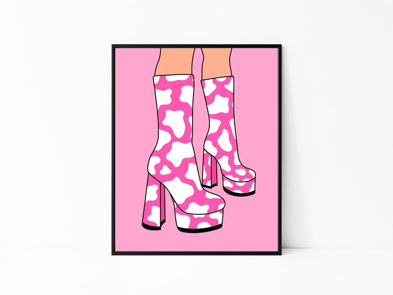 May include: Pink platform boots with a white cow print design. The boots have a thick heel and a platform sole.