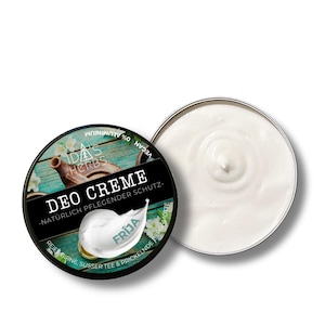 Könnte beinhalten: Ein runder, schwarzer Behälter mit weißer Deocreme mit dem Text "DEO CREME" und "FRIJA". Der Deckel ist abgenommen und zeigt die Textur der Creme. Das Produkt ist als vegan und ohne Aluminium gekennzeichnet.