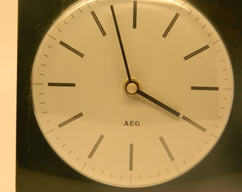 Vintage 1960's retro deco style AEG mantel clock  This original 1960s AEG clock stands freely on its wedge-shaped feet and is ideal for use
