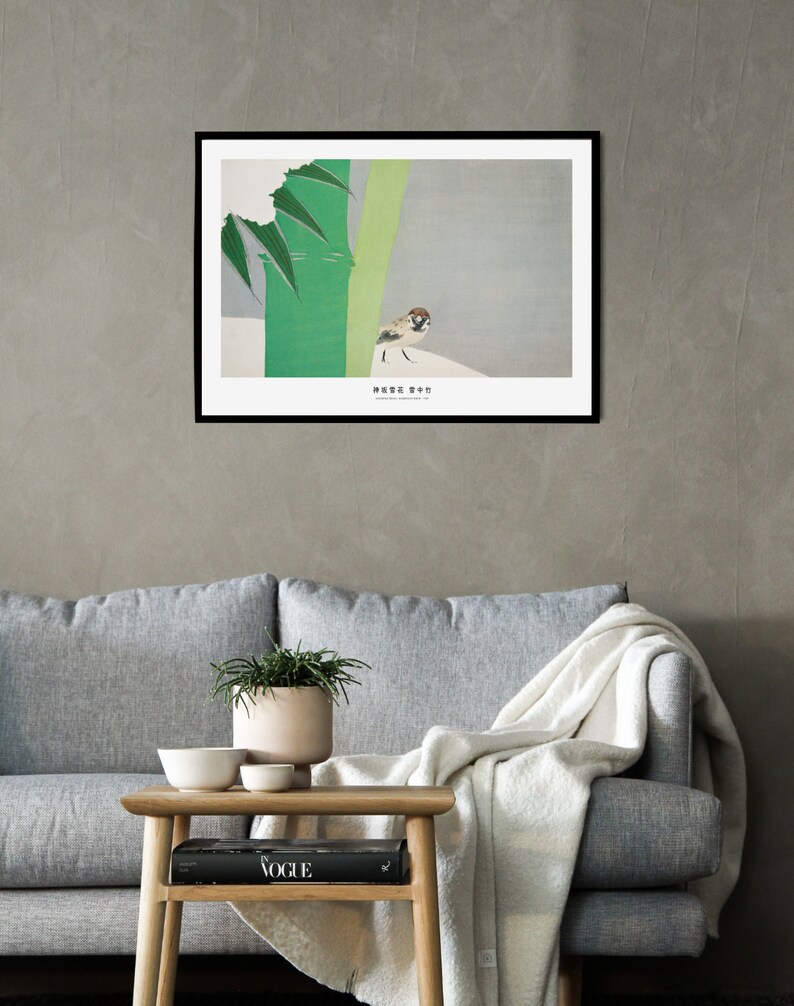 May include: A framed print of a sparrow perched on a branch with green leaves against a light gray background. The print has the Japanese text "雀" which means sparrow.