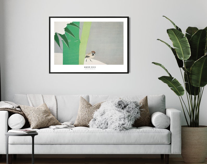 May include: A framed print of a minimalist Japanese-style illustration of a sparrow perched on a branch with green leaves. The print has a white background and the text "鳥は歌を歌う" in black.