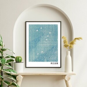 May include: A framed print of a blue and white Japanese woodblock print depicting a landscape with a mountain range and a sky filled with white birds. The print is titled "日本橋" in Japanese.