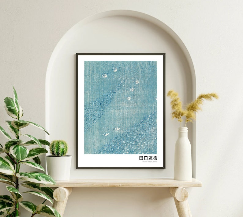 May include: A framed print of a blue and white Japanese woodblock print depicting a landscape with a mountain range and a sky filled with white birds. The print is titled "日本橋" in Japanese.
