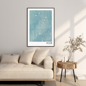 May include: A framed print of a Japanese woodblock print depicting a blue and white scene with birds flying over a body of water. The print is titled "田口 友樹".