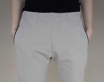 Beige pants with zipper details