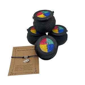 May include: A black string bracelet with a silver charm of a potion bottle and a book. The bracelet is packaged with four small black cauldron-shaped boxes with colourful lids. The boxes have a quote on a brown card that reads "It takes a truly great wizard to produce such magnificent potions. Wear this bracelet as a mark of your magical talents."