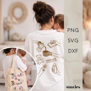 May include: White t-shirt with a brown graphic design on the back featuring a coffee pot, mug, teddy bear, pacifier, and baby bottle. The text "MOM LIFE full hands, full heart" is also included. A tote bag with the same design is also visible.