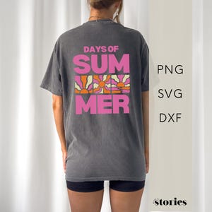 May include: Dark gray t-shirt with the words "DAYS OF SUMMER" in pink and orange block letters. The design includes a retro sun graphic. The shirt is a casual, unisex style.