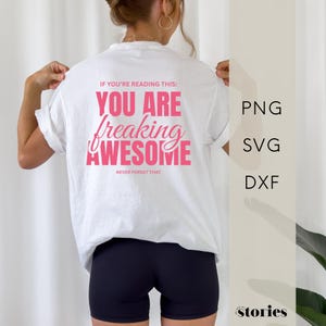 May include: A white t-shirt featuring pink text on the back that reads: IF YOU'RE READING THIS: YOU ARE freaking AWESOME NEVER FORGET THAT. The shirt is paired with black shorts. To the right, the text PNG, SVG, and DXF is displayed vertically.