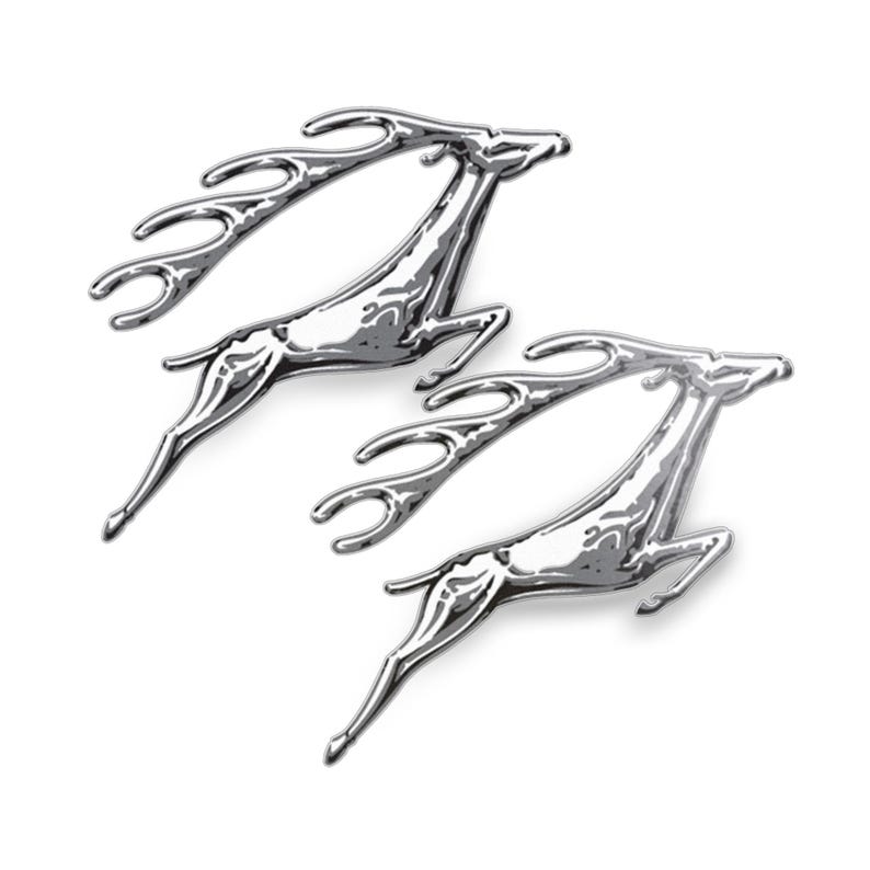 May include: Two chrome-finished leaping deer figurines. The deer are depicted in mid-jump, with detailed antlers and streamlined bodies. The reflective surface of the metal creates highlights and shadows, enhancing the three-dimensional effect. The figurines are set against a plain white background.