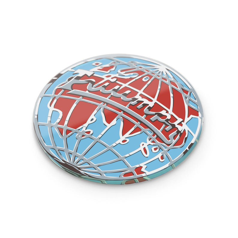May include: A round, silver-colored pin featuring a globe design. The globe is divided into red and blue sections, with silver lines representing the continents and the word "Future" in a stylized font across the center.