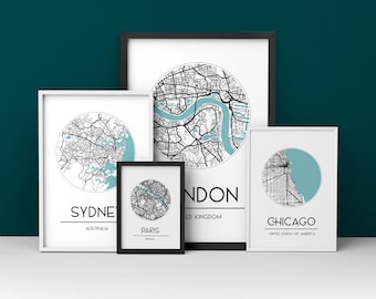 May include: A collection of framed city map prints, including London, Sydney, Paris, and Chicago. Each print features a circular map design with teal accents. The city names and country names are printed below the maps in a clean, minimalist style.