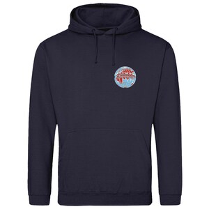 May include: A navy blue hoodie with a front pouch pocket and a drawstring hood. It features a circular emblem on the chest with a globe design in red, white, and blue. A casual, comfortable garment.