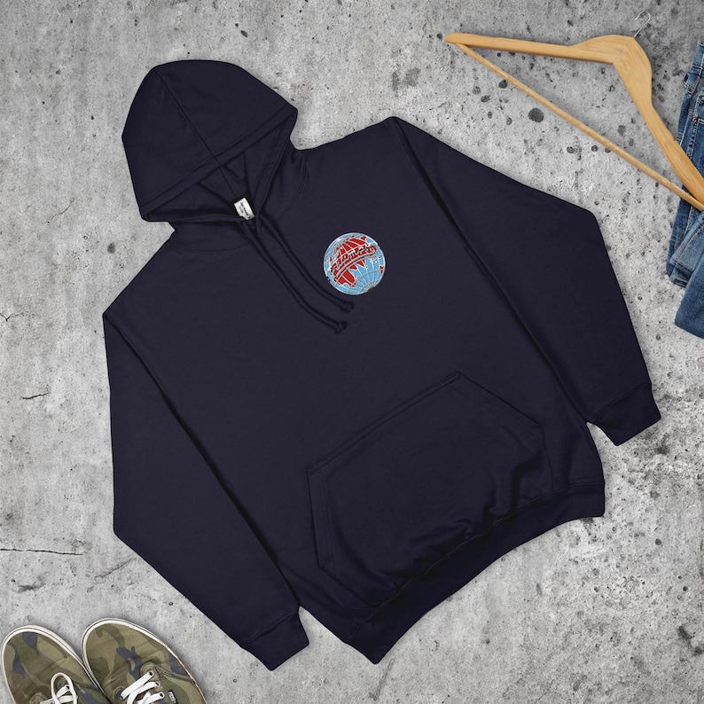 May include: Navy blue hooded sweatshirt with a front pocket and a drawstring hood. The sweatshirt features a small embroidered globe design with red and blue accents on the upper left chest.