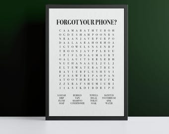 Könnte beinhalten: Ein Schwarzweiß-Wortsuchrätsel mit dem Titel "Forgot Your Phone?" Das Rätsel enthält Wörter, die mit einem Badezimmer zu tun haben, wie "Bad", "Seife", "Wasser", "Handtuch" und "Spüle".