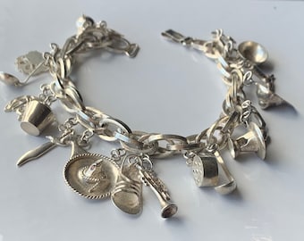 Vintage, 20th Century/ 1950s/  [MADE IN MEXICO] Sterling Silver Charm Bracelet with  a Variety of 19 Different Sterling Silver Charms