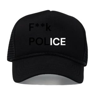 May include: Black trucker hat with the text "F**k POLICE" in white block letters. The hat has a mesh back and a curved brim. The text is centered on the front of the hat.