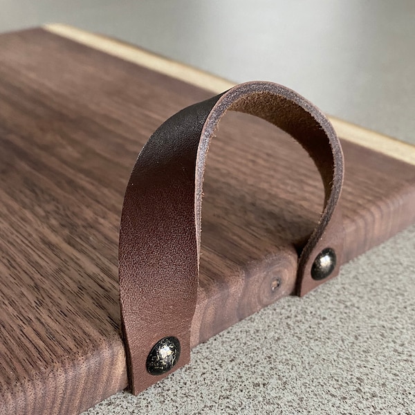 Add handles to your charcuterie board. We offer medium/dark brown leather handles.