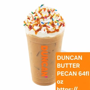 May include: A clear plastic cup filled with iced coffee, topped with whipped cream, caramel drizzle, and colorful sprinkles. The cup has the word "DUNCAN" in orange on the side. The drink is labeled "BUTTER PECAN 64 fl oz".