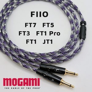 May include: Braided audio cable with purple, white, and gray strands. The cable features black connectors with gold-colored tips. The text "FIIO" and model numbers are visible. The "MOGAMI" logo is at the bottom.
