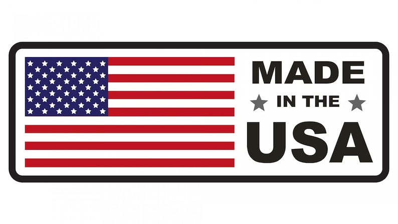 May include: A white rectangle with a black border, featuring a red, white, and blue American flag on the left side and the text "MADE IN THE USA" in black on the right side.
