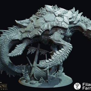 May include: A gray 3D printed miniature of a sea turtle with a dragon-like head, standing on a sunken ship. The turtle has a detailed shell with coral and seaweed growing on it. The miniature is set on a circular base with sand and rocks.