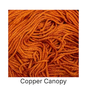 May include: Close-up of a skein of Copper Canopy yarn. The yarn is a rich, warm orange color, with a slightly textured appearance. The text "Copper Canopy" is displayed at the bottom of the image. This yarn is suitable for various knitting and crochet projects.