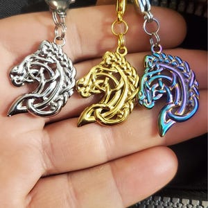 May include: Three Celtic knot horse head keychains in silver, gold, and iridescent blue.