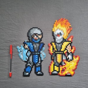 May include: Two pixel art figures made of colorful beads. The figure on the left is blue and white and the figure on the right is yellow and orange.