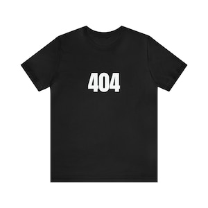May include: A black t-shirt with the number 404 printed in white on the front.