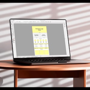 May include: A laptop computer screen displaying a mockup of a website design. The design includes a yellow box with the text "Primary Logo Here" and "Secondary Logo Here" and "Brand Mark Here".
