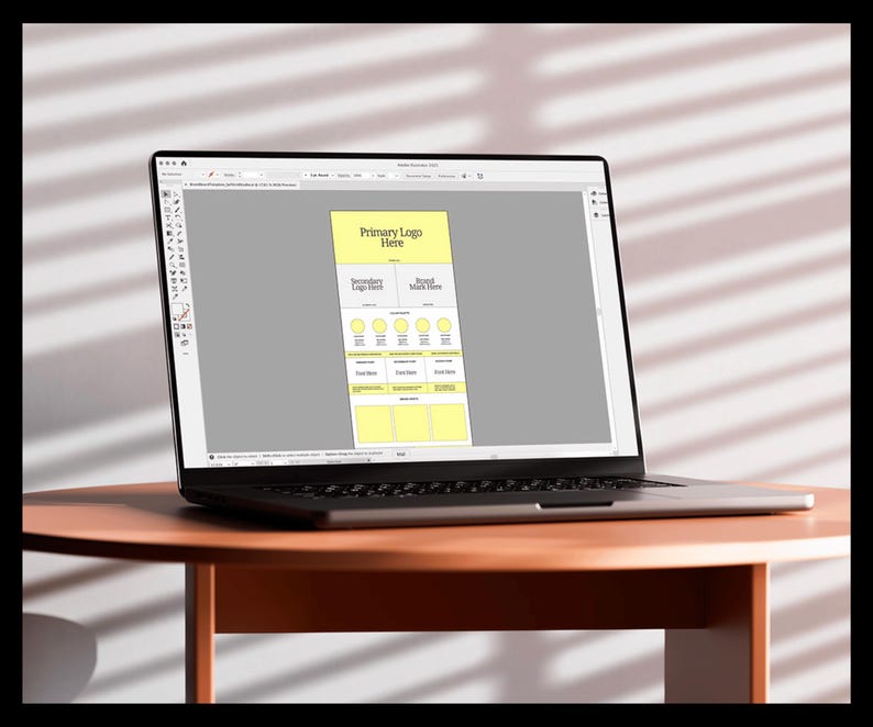 May include: A laptop computer screen displaying a mockup of a website design. The design includes a yellow box with the text "Primary Logo Here" and "Secondary Logo Here" and "Brand Mark Here".